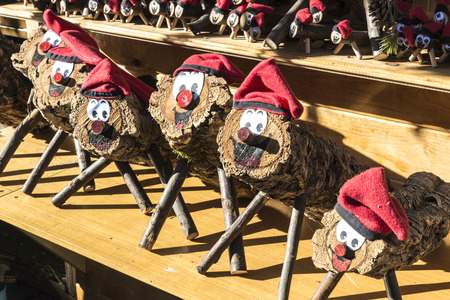 Barcelona, Spain - December 19, 2014: Santa Llucia Fair is a Christmas market items where a significant figure is the Caga Tio, typical figure Catalan manger. Caga Tio is a wooden log with a smiley face painted onto one endのeditorial素材