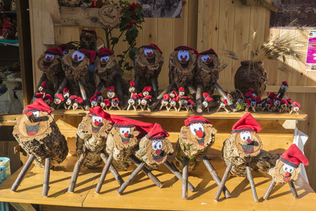 Barcelona, Spain - December 19, 2014: Santa Llucia Fair is a Christmas market items where a significant figure is the Caga Tio, typical figure Catalan manger. Caga Tio is a wooden log with a smiley face painted onto one endのeditorial素材