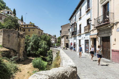Granada, Spain - August 12, 2015: Bridge over the River Darro in the old town of Granada, Andalusia.のeditorial素材