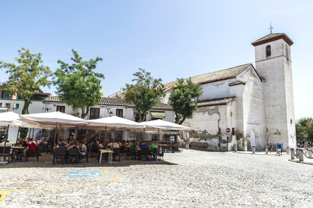 Granada, Spain - August 12, 2015: Church, bar and restaurant in a square in the historic district of Albaicin, opposite the hill of the Alhambra in Granadaのeditorial素材