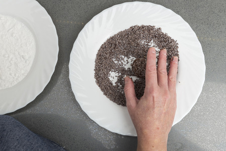 Woman preparing chocolate truffles in the kitchenの写真素材
