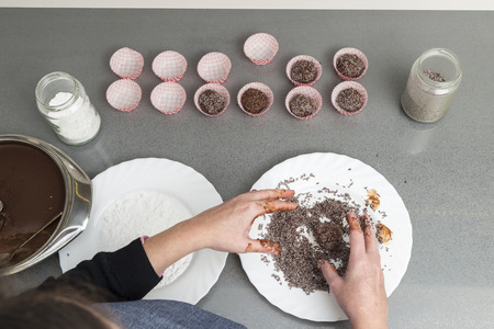 Woman preparing chocolate truffles in the kitchenの写真素材