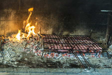 Grilled meat making in the kitchen of a restaurant in Spainの写真素材