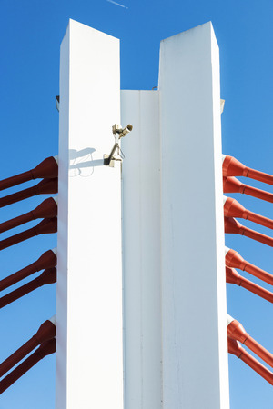 Detail of a suspension bridge and a security camera in Barcelona, Catalonia, Spainの写真素材