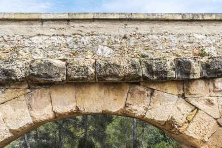 Detail of an arch of the roman aqueduct called Pont del Diable in Tarragona, Catalonia, Spainの写真素材