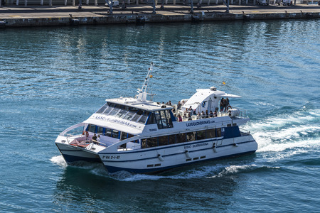Barcelona, Spain - April 19, 2016: Tourists aboard a pleasure motorboat called Las Golondrinas in port of Barcelona , Catalonia, Spainのeditorial素材
