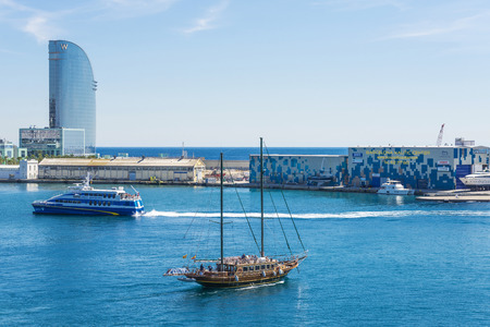 Barcelona, Spain - April 19, 2016: Large wooden sailing ship sailing from the port of Barcelona with the W hotel in the backgroundのeditorial素材