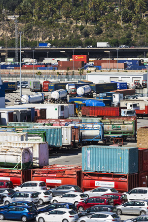 Barcelona, Spain - April 19, 2016: Heavy freight in containers and new cars in the port of Barcelona, Catalonia, Spainのeditorial素材