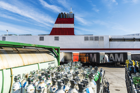Barcelona, Spain - April 19, 2016: Oxygen cylinders and containers ready for transport in the port of Barcelona, Catalonia, Spainのeditorial素材