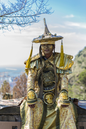 Barcelona, Spain - April 15, 2016: Man disguised as Mandarin Chinese in Barcelona, Catalonia, Spainのeditorial素材