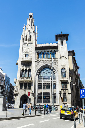 Barcelona, Spain - April 19, 2016: Former headquarters of CaixaBank. It is an Modernism style building with Gothic inspirations located in the old town of Barcelonaのeditorial素材