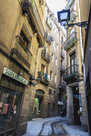 Barcelona, Spain - April 19, 2016: Street of the old town of Barcelona with people walking in Catalonia, Spainのeditorial素材