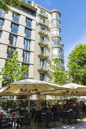Barcelona, Spain - May 25, 2016: Terrace of a bar and a residential building of Modernism style in Barcelona, Catalonia, Spainのeditorial素材