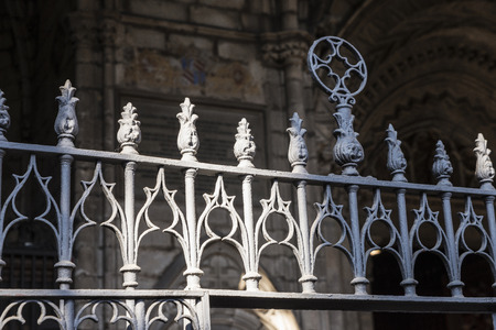Old wrought iron fence in the cloister of the Cathedral of Barcelona, Catalonia, Spainの写真素材