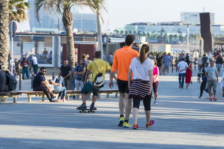 Barcelona, Spain - June 1, 2016: Barcelona promenade full of people walking or playing sportsのeditorial素材