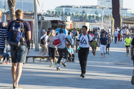 Barcelona, Spain - June 1, 2016: Barcelona promenade full of people walking or playing sportsのeditorial素材