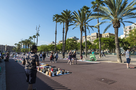 Barcelona, Spain - June 1, 2016: Flea market in the port Vell. This market consists of immigrants
and it is illegal because fakes are sold.のeditorial素材