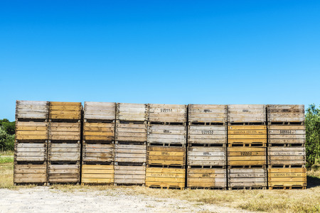 Girona, Spain - June 22, 2016: Heap of old wooden boxes for storing fruit in Girona, Catalonia,...