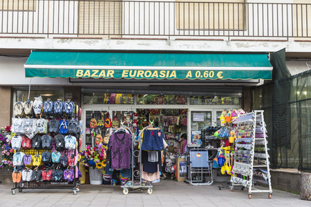 Estartit, Spain - June 24, 2016: Objects of all kinds in a souvenir shop highlighting swimsuit and flip flops in the Costa Brava, Catalonia, Spainのeditorial素材