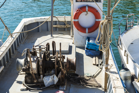 Small fishing boat moored in fishing port of Estartit located in the Costa Brava, Girona, Catalonia, Spainの写真素材