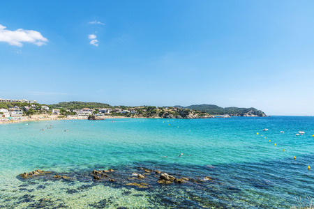 Overview of La Fosca beach full of bathers in Costa Brava, Catalonia, Spainの写真素材