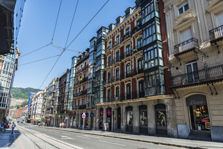 Bilbao, Spain - August 13, 2016: Street of the old town of Bilbao with people walking and its classic residential buildingsのeditorial素材