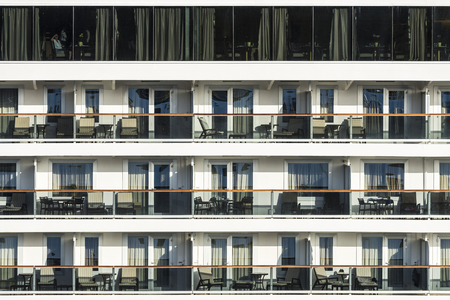 Barcelona, Spain - August 27, 2016: Woman watching from his cabin on a cruise in the port of Barcelona in Catalonia, Spainのeditorial素材