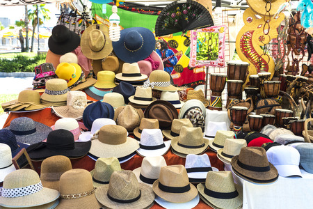 Olbia, Italy - August 24, 2016: Objects of all kinds in a souvenir shop highlighting panama hat in a flea market in  Olbia, Sardinia, Italyのeditorial素材