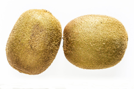 Elevated view of two kiwis isolated on white backgroundの写真素材