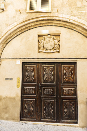 Entrance of a historic building in the old town of Alghero, Sardinia, Italyの写真素材