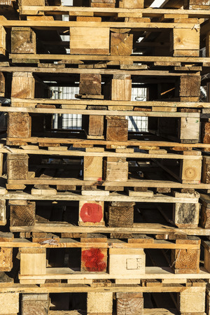 Wooden pallet overlap in warehouseの写真素材