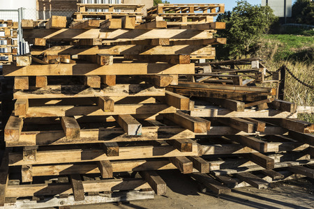 Wooden pallet overlap in warehouseの写真素材