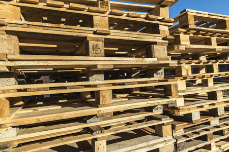 Wooden pallet overlap in warehouseの写真素材