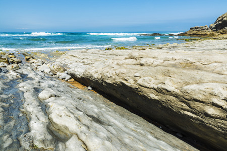 Rocky beach near cliffs in Ubiarco in Cantabria, Spainの写真素材