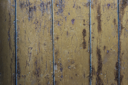 Closeup of an old cracked wood door as backgroundの写真素材