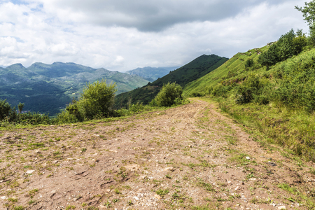 Landscape of a road between mountains and meadows in Cantabria, Spainの写真素材