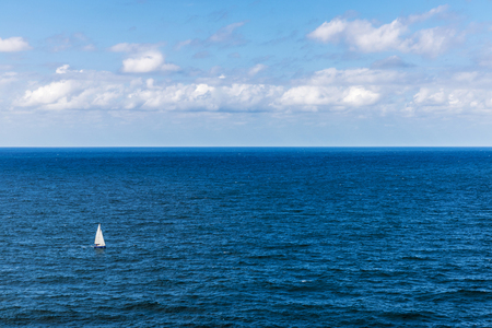 White sailboat sailing the sea in Spainの写真素材
