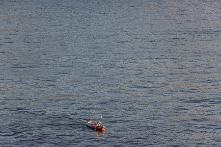 Cantabria, Spain - August 7, 2016: Two young men paddling on a kayak in the Atlantic Oceanのeditorial素材