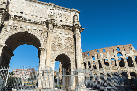 Arch of triumph known as Arch of Constantine with the coliseum in the background in Rome, Italyの写真素材