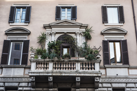 Balcony with plant pots of a classical building in the historical center of Rome, Italyの写真素材