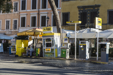 Rome, Italy - December  30, 2016: Agip gas station with worker sitting on a street in the old town of Romeのeditorial素材