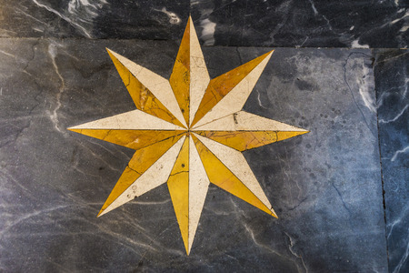 Marble floor decorated with a star of the basilica of St. Mary of the Angels and the Martyrs (Santa Maria degli Angeli e dei Martiri) in Rome, Italyの写真素材