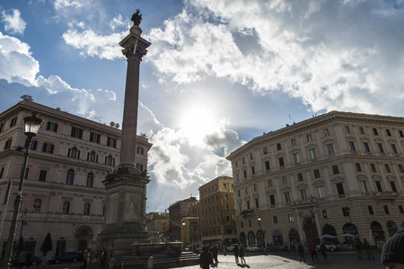 Rome, Italy - January 3, 2017: Street of the old town of Rome with the sun in the clouds and people walking in Rome, Italy.のeditorial素材