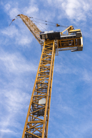Construction cranes working on the construction of a skyscraper in Berlin, Germany.の写真素材