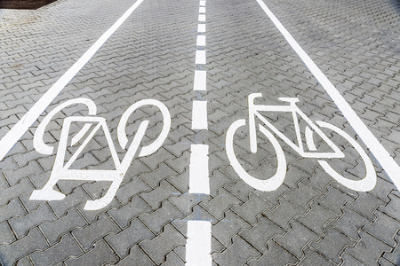 Bicycle road sign on bike lane in Berlin, Germanyの写真素材