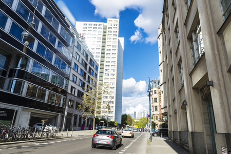 Berlin, Germany - April 13, 2017: Street with traffic and modern blocks of flats and offices with the reflected telecommunications tower in Berlin, Germanyのeditorial素材