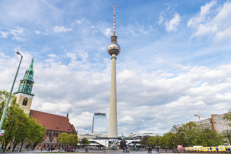Berlin, Germany - April 13, 2017: St Mary church (Marienkirche) and telecommunications tower with people walking in Alexanderplatz square in Berlin, Germanyのeditorial素材