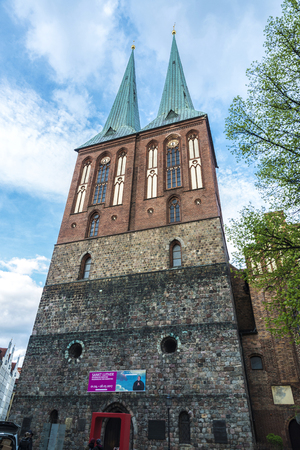 Berlin, Germany - April 13, 2017: St. Nicholas Church (Nikolaikirche) is the oldest church with people walking around in Berlin, Germany.のeditorial素材