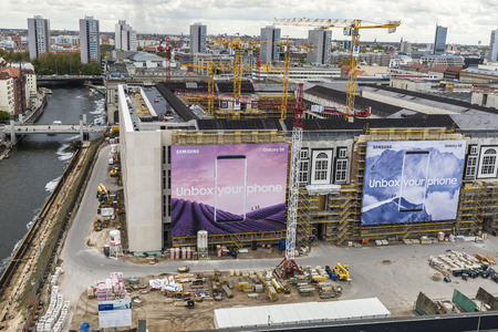 Berlin, Germany - April 13, 2017: Overview of Berlin with many construction cranes and mobile phone ads Samsung Galaxy S8 in Berlin, Germanyのeditorial素材
