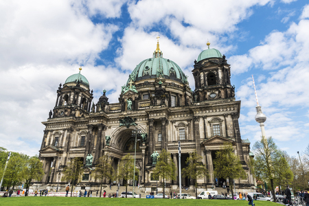 Berlin, Germany - April 13, 2017: The Berlin Cathedral (Berliner Dom) of Neobaroque style and the telecommunications tower in the background with people walking around in Berlin, Germany.のeditorial素材